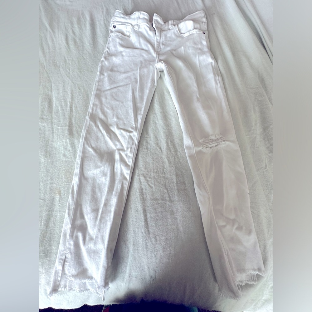 White skinny jeans with fringe bottom